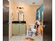 Well-lit bathroom with colorful shower curtain and vanity storage at 89 Mangum Sw St # 119, Atlanta, GA 30313