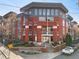 Modern brick apartment building featuring multiple balconies and professional landscaping at 89 Mangum Sw St # 119, Atlanta, GA 30313