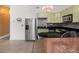 Modern kitchen with stainless steel appliances, ample counter space, and adjacent seating at 89 Mangum Sw St # 119, Atlanta, GA 30313