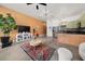 Bright and airy living room featuring modern furniture, a colorful rug, and industrial-style concrete floors at 89 Mangum Sw St # 119, Atlanta, GA 30313
