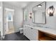 Modern bathroom featuring marble countertops, herringbone floors, and custom lighting fixtures at 96 The Prado Ne, Atlanta, GA 30309