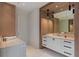 Stylish bathroom featuring a white vanity, sleek fixtures, and wood-trimmed mirrors at 96 The Prado Ne, Atlanta, GA 30309