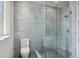 Contemporary bathroom featuring a glass-enclosed shower and tile walls at 96 The Prado Ne, Atlanta, GA 30309