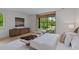 Bedroom featuring a large window, a chaise lounge, and views of the greenery outside at 96 The Prado Ne, Atlanta, GA 30309