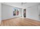 Bright bedroom featuring hardwood floors, a ceiling fan, and a view to an ensuite bathroom at 96 The Prado Ne, Atlanta, GA 30309