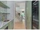 Stylish butler pantry with custom cabinets, open shelving, and wine refrigerator at 96 The Prado Ne, Atlanta, GA 30309