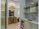 Butler pantry with open shelving, custom cabinets and countertop sink open to dining room at 96 The Prado Ne, Atlanta, GA 30309