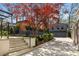 Long driveway leading to a two-car garage, with lush landscaping at 96 The Prado Ne, Atlanta, GA 30309