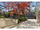 Two-car garage and stylish back house framed by mature trees, complemented by professional landscaping and a private driveway at 96 The Prado Ne, Atlanta, GA 30309