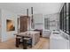 Modern kitchen featuring a large island, stainless steel appliances, and black steel window frames at 96 The Prado Ne, Atlanta, GA 30309