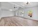 Bright living room with natural light, hardwood floors, vaulted ceiling and views of lush landscaping, creating a serene atmosphere at 96 The Prado Ne, Atlanta, GA 30309