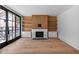 Bright living room featuring a modern fireplace, custom built-ins, and large glass doors at 96 The Prado Ne, Atlanta, GA 30309