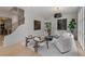 Elegant living room with staircase, modern lighting, and stylish furniture at 96 The Prado Ne, Atlanta, GA 30309