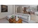 Bright living room featuring a sectional sofa and a view of the kitchen area at 96 The Prado Ne, Atlanta, GA 30309