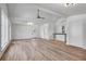Bright living area boasting wide-plank floors, a modern ceiling fan, mini split unit, and natural light throughout at 96 The Prado Ne, Atlanta, GA 30309