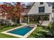 Backyard pool with a modern design and lush landscaping at 96 The Prado Ne, Atlanta, GA 30309