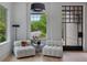 Sitting area with hardwood floors, large windows, and stylish furniture at 96 The Prado Ne, Atlanta, GA 30309