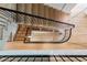 View looking down on a modern staircase with a black railing and wooden steps at 96 The Prado Ne, Atlanta, GA 30309