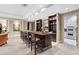 Entertain in style with this home bar featuring custom wood shelving, marble accents, and a pass-through to the kitchen at 3286 Northside Nw Pkwy # 1007, Atlanta, GA 30327