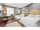 Comfortable bedroom features hardwood floors, two twin beds, elegant decor, and a sitting area at 3286 Northside Nw Pkwy # 1007, Atlanta, GA 30327