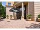 Elegant building entrance with columns, detailed ironwork, and manicured landscaping provides a luxury arrival experience at 3286 Northside Nw Pkwy # 1007, Atlanta, GA 30327