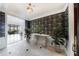 Grand entryway featuring designer wallpaper, light tile flooring, and a view of the outdoor living space at 3286 Northside Nw Pkwy # 1007, Atlanta, GA 30327