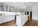 Gourmet kitchen featuring marble countertops, custom cabinetry, and stainless steel appliances at 3286 Northside Nw Pkwy # 1007, Atlanta, GA 30327