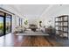 Bright living room with hardwood floors, large windows, and stylish decor with deck access at 3286 Northside Nw Pkwy # 1007, Atlanta, GA 30327