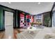 Bright living room featuring a custom bookcase and large windows at 3286 Northside Nw Pkwy # 1007, Atlanta, GA 30327