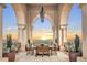 Covered outdoor patio with dining area and beautiful sunset views at 3286 Northside Nw Pkwy # 1007, Atlanta, GA 30327