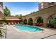 Community pool area with lounge chairs and lush landscaping at 3286 Northside Nw Pkwy # 1007, Atlanta, GA 30327