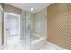 Modern glass-enclosed shower with built-in seat and stylish tile at 3286 Northside Nw Pkwy # 1007, Atlanta, GA 30327
