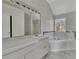 Bathroom with large tub, double sink vanity and natural light at 3635 Spring Mesa Dr, Snellville, GA 30039