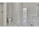 Bathroom featuring marble tile flooring, a modern vanity, and a shower with glass enclosure at 3635 Spring Mesa Dr, Snellville, GA 30039
