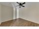 Comfortable bedroom with wood flooring, modern ceiling fan, and neutral paint at 3635 Spring Mesa Dr, Snellville, GA 30039