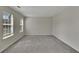 Spacious bedroom with neutral carpet and paint, featuring large windows for plenty of natural light at 3635 Spring Mesa Dr, Snellville, GA 30039