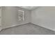 Bedroom with plush carpet, a window for natural light and fresh paint at 3635 Spring Mesa Dr, Snellville, GA 30039
