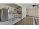 Kitchen featuring white cabinets and stainless steel appliances open to the living space at 3635 Spring Mesa Dr, Snellville, GA 30039