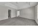 Spacious main bedroom featuring neutral paint, tray ceiling and plush carpeting at 3635 Spring Mesa Dr, Snellville, GA 30039