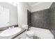 Bathroom featuring gray tile and a vanity sink at 6490 Lake Esther Dr, Fairburn, GA 30213