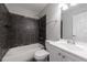 Bathroom with tiled shower and a sink with vanity at 6490 Lake Esther Dr, Fairburn, GA 30213