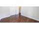 A bedroom features wood flooring, light gray walls, and a closet at 6490 Lake Esther Dr, Fairburn, GA 30213