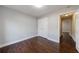 Bedroom with ample closet space and hardwood floors at 6490 Lake Esther Dr, Fairburn, GA 30213