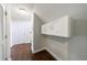 Hallway with hardwood floors and cabinets near the top of the stairs at 6490 Lake Esther Dr, Fairburn, GA 30213