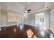 Expansive living room featuring hardwood floors, a trey ceiling, recessed lighting and a fireplace at 6490 Lake Esther Dr, Fairburn, GA 30213