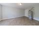 Neutral room featuring tile flooring and a water heater at 6490 Lake Esther Dr, Fairburn, GA 30213