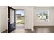 Welcoming entryway showcases view to exterior, with natural light and neutral walls at 989 Blue Juniper Cir, Loganville, GA 30052
