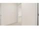 Hallway with fresh neutral paint and carpet at 989 Blue Juniper Cir, Loganville, GA 30052