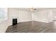 Open-concept living room featuring a fireplace and hardwood floors at 989 Blue Juniper Cir, Loganville, GA 30052