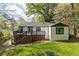 View of the backyard with an elevated deck, ideal for enjoying outdoor activities and gatherings at 1194 Clearview Ne Dr, Brookhaven, GA 30319